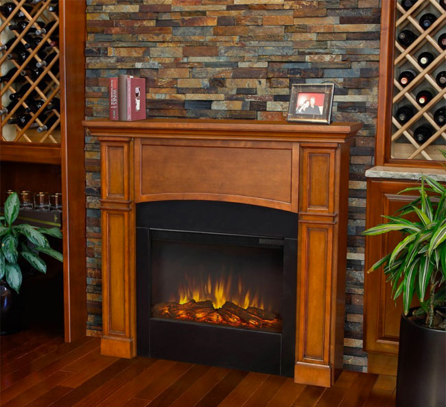 Real Flame Slim Electric Fireplace Against Stone Wall in Living Room
